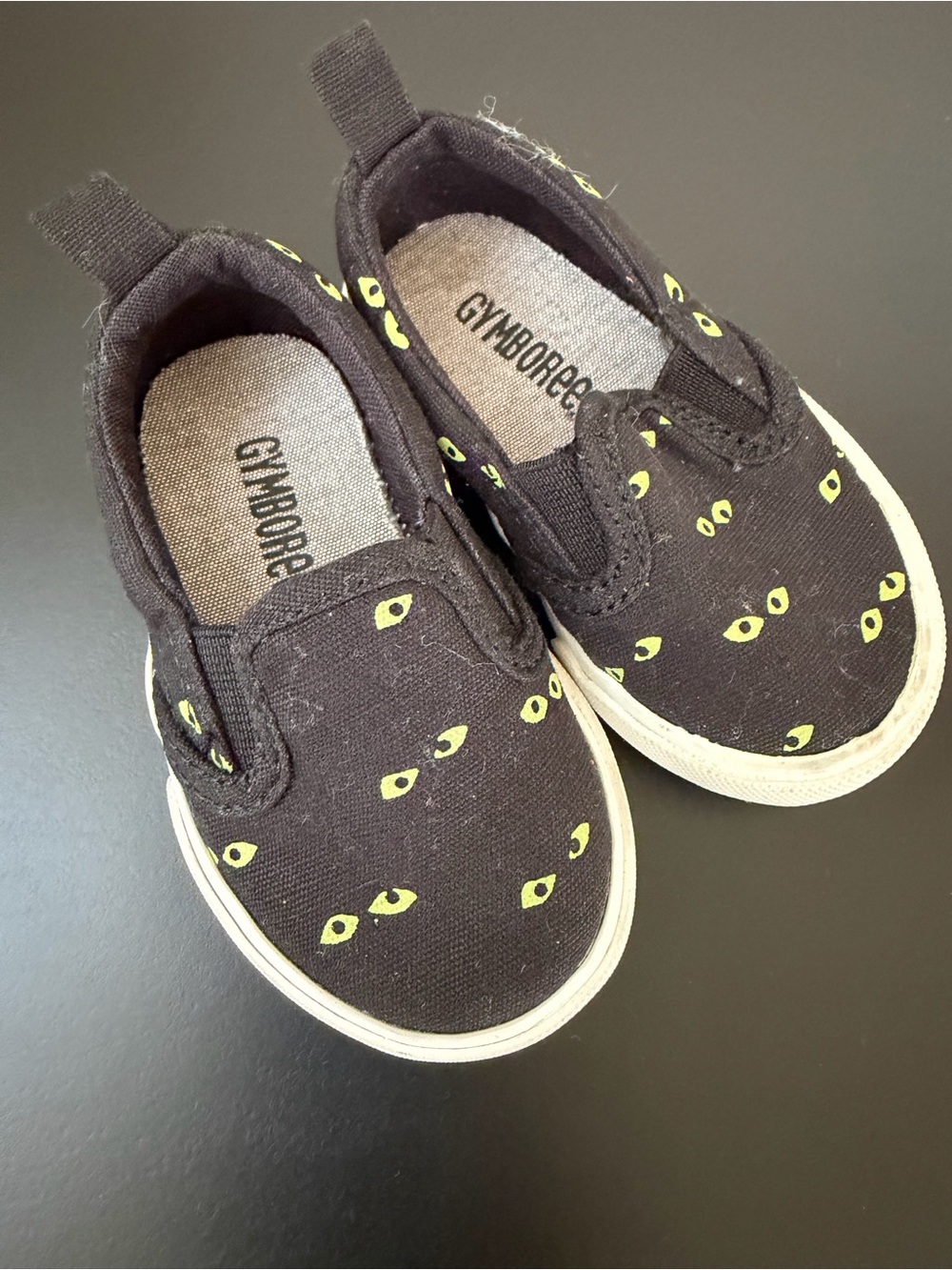 Gymboree Black Slip-On Sneakers with yellow eyes
